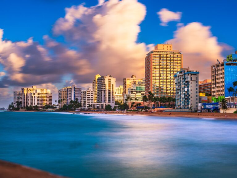 San Juan, Puerto Rico resort skyline on Condado Beach on dusk.
